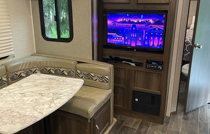 U-shaped dinette, TV, and radio