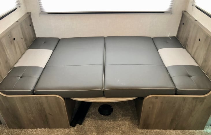 Slide out dinette folds into a full size bed.