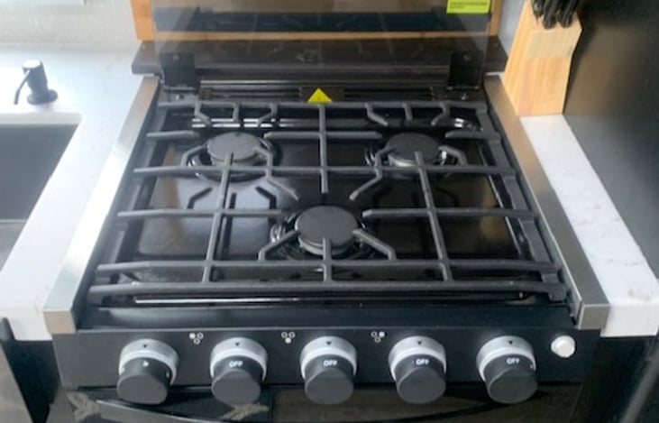 3 Burner propane cooktop with oven.