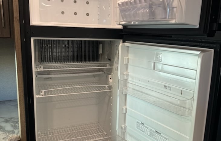 Large refrigerator and freezer, works on elec or LP gas