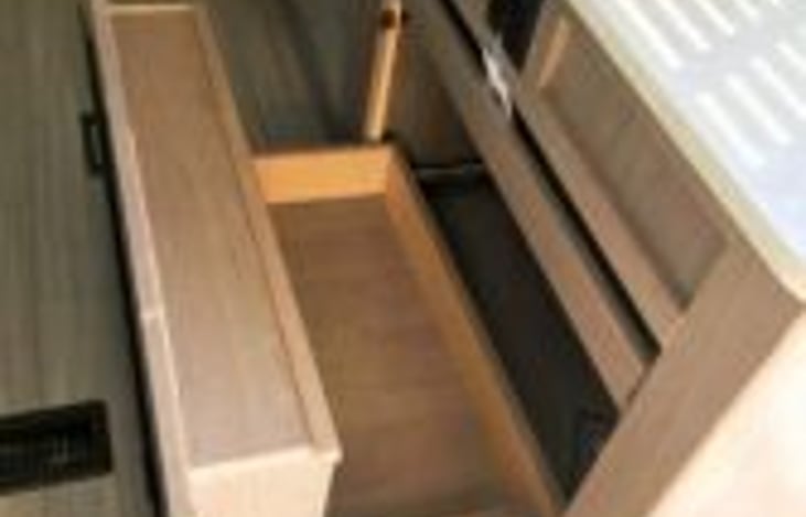 storage drawer behind fire place
