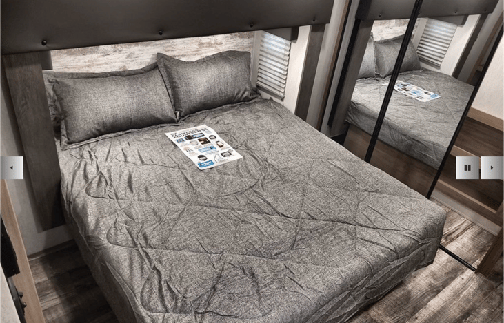 King bed (bedding is different than pictured) in primary bedroom.