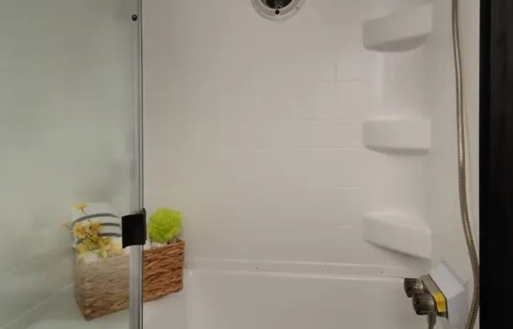 An actual stand-up shower with a beautiful, powerful shower head.