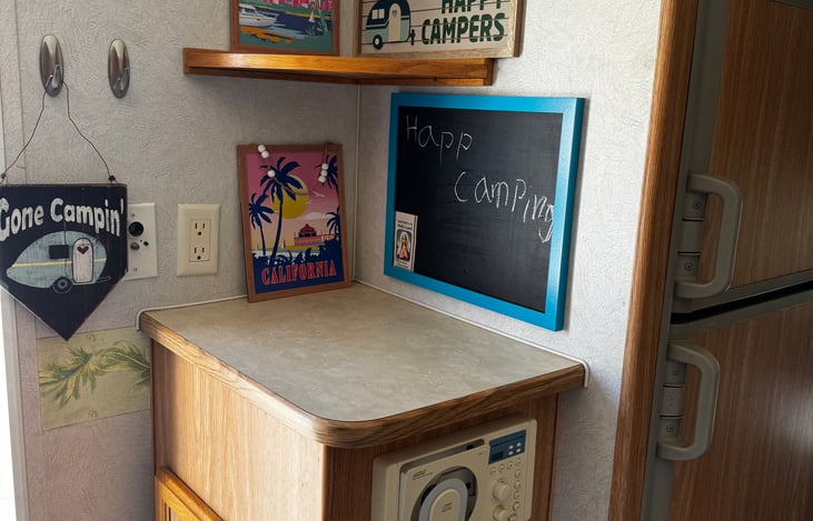 The cabinet near the refrigerator is great for a laptop or any streaming device that can be seen while eating. Also, the TV in the back near the queen bed can swivel to be seen from the dinette.