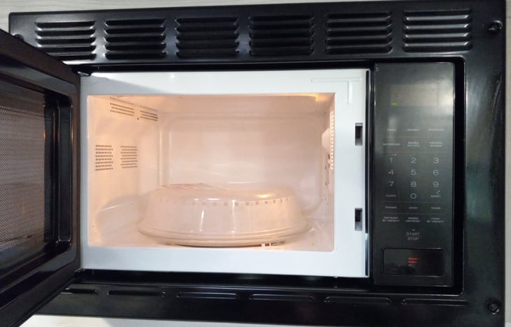 There is a full-functioning microwave and microwavable dishes for your use