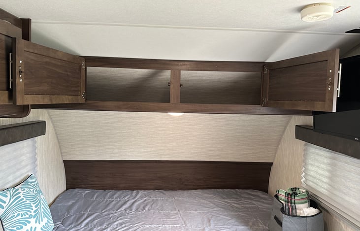 Above above queen bed Storage for personal items.
