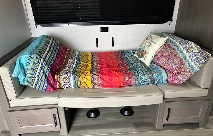 The dinette lowers into a bed.