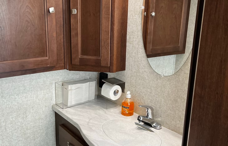 Bathroom sink and cabinet view.