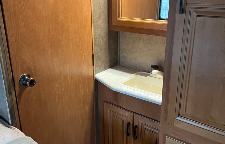 Bedroom sink with near by draws.