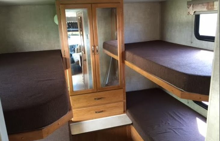with 4 bunk beds in back there is ample room to sleep adults or kids.
