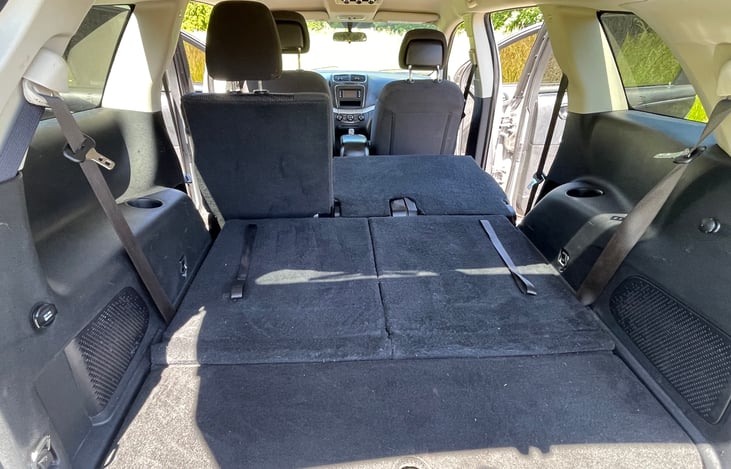 Width between wheel wells 41.4", Cargo bed Height 33.1" Interior length, 84". The 2nd row is slightly elevated.