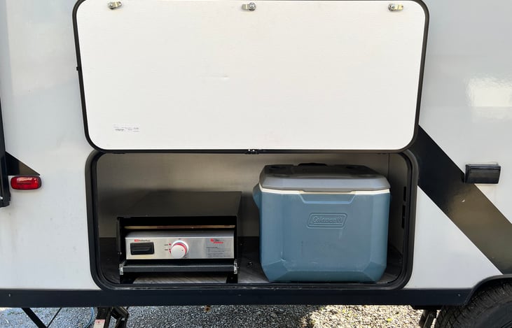 Camp side storage/outdoor kitchen area with griddle closed