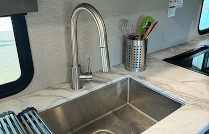 Spacious stainless sink with top mat removed