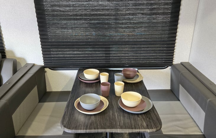 Dinette seats four and converts to a small bed.