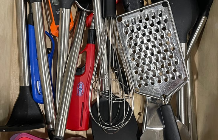 fully stocked cooking utensil drawer