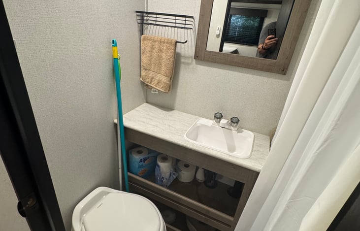 Clean and functional bathroom with toilet and sink
