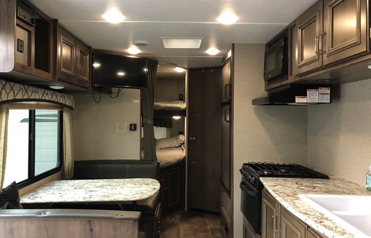 Interior facing front. Table lowers into bed.