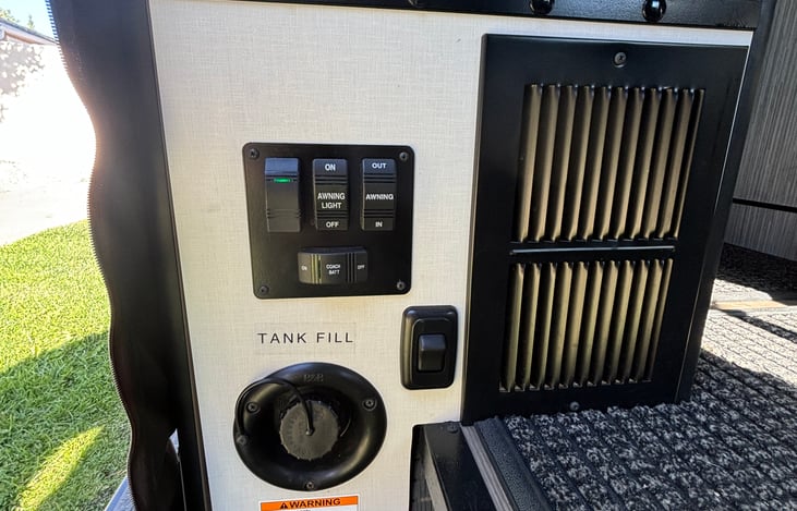 Awning controls and house battery on/off switch