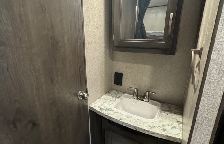 Separate sink area for the restroom.