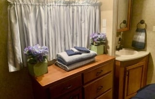 A 5th wheel travel trailer suited for 2 people