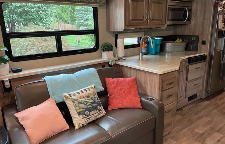 Living room sofa that opens up to a queen size bed.  There is also a retractable 51" retractable television behind the living room sofa.