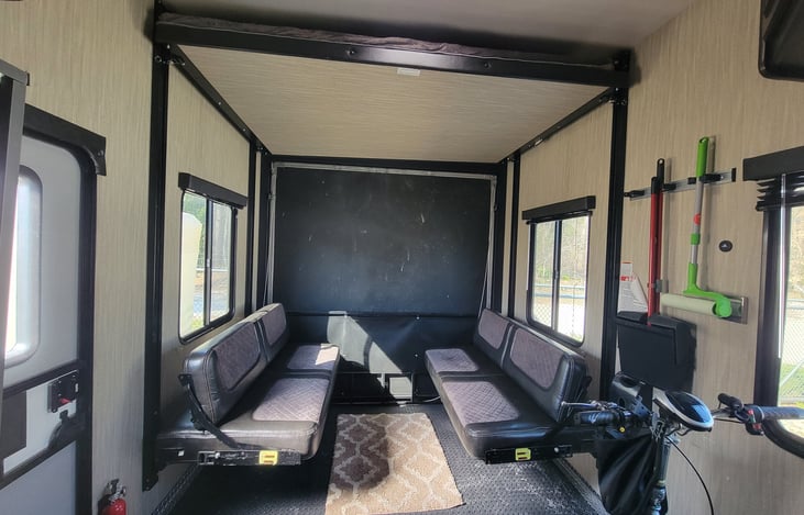 This picture shows the seats down, the bed above also slides down with the push of a button. Plenty of room for entertaining, transporting "expensive" toys or sleeping 4.