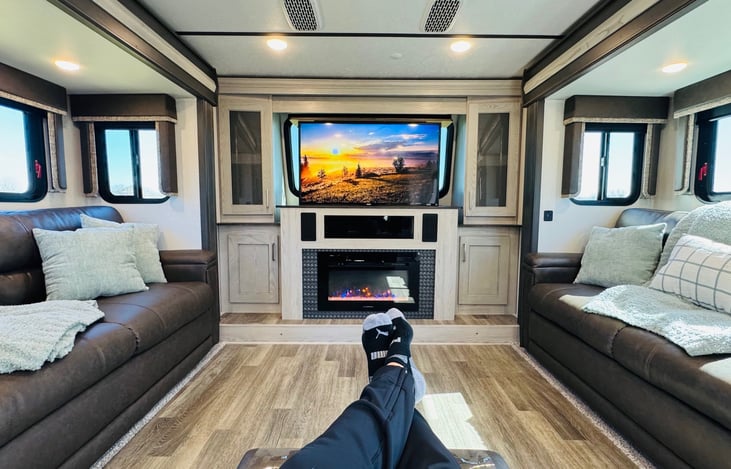 View of living room from recliner with Roku TV.