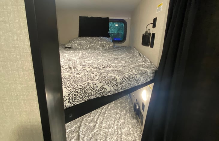 Bunk beds. Sleeps comfortably 2x kids on each. Iphone chargers included as part of rental.