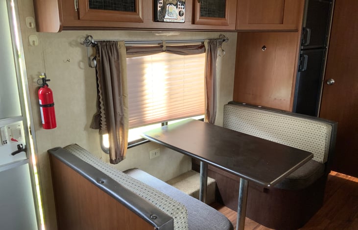 Dining table converts to 5th bed if needed. DVD player and TV (not shown).