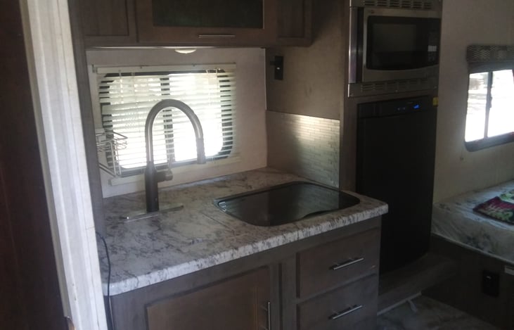 Microwave and convection combo. 3 way refrigerator. 2 burner stove top.