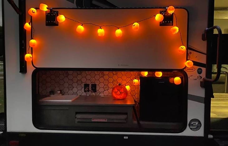 Outdoor kitchen includes sink and fridge