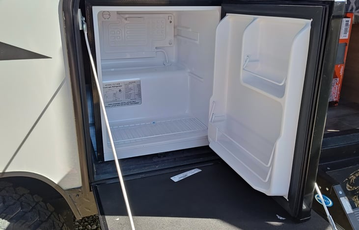 Outside mini fridge.