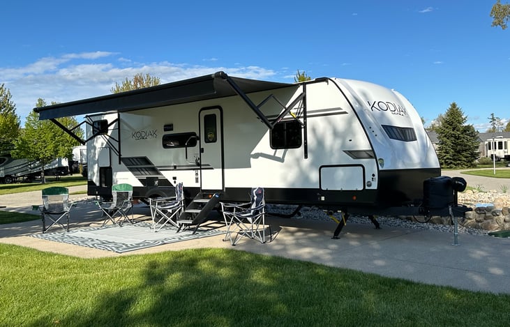 Outdoor fridge in the rear compartment, power awning, and outdoor matt included in rental.