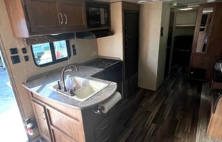 Camper with a queen living space and a bunkhouse.