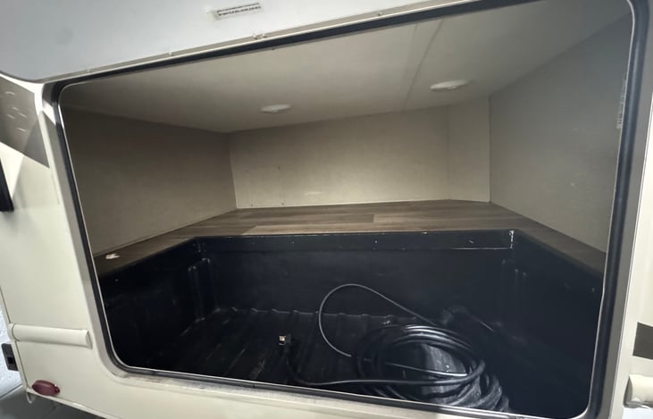 Storage area available on right side of RV.