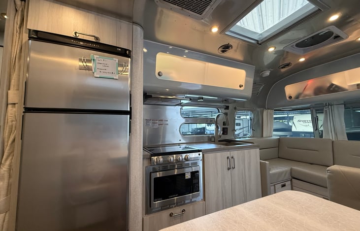 A slightly better view of kitchen with the refrigerator.