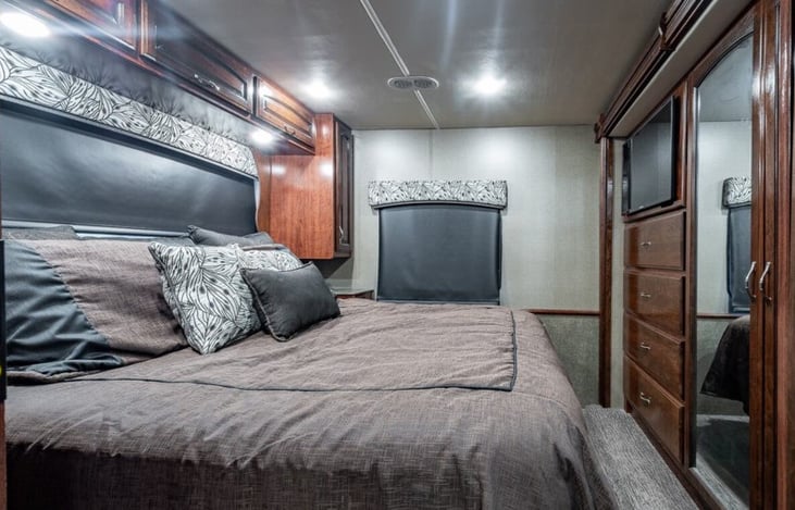 Master bedroom offers plenty of storage and sleeping area. Blackout shades throughout allow for sleeping in on recovery days.