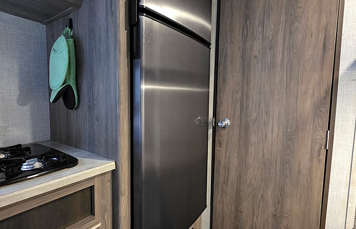 Refrigerator and gas range top