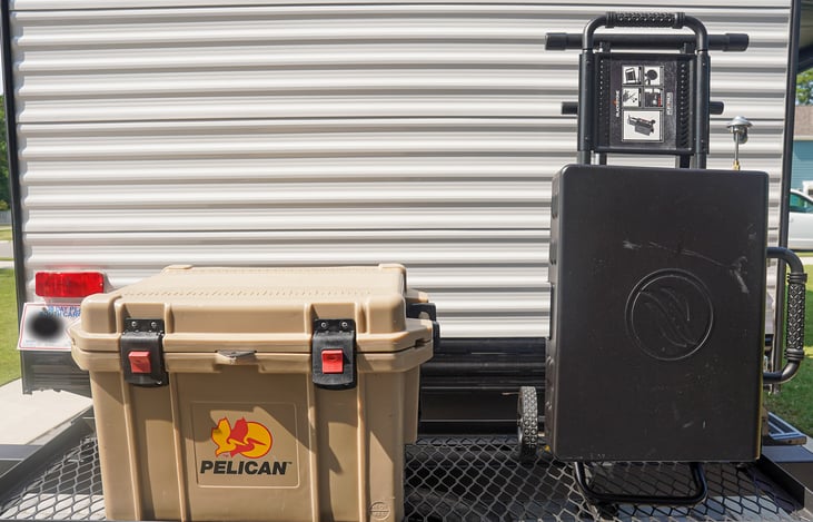 Cooler and Blackstone store great on the tow rack!