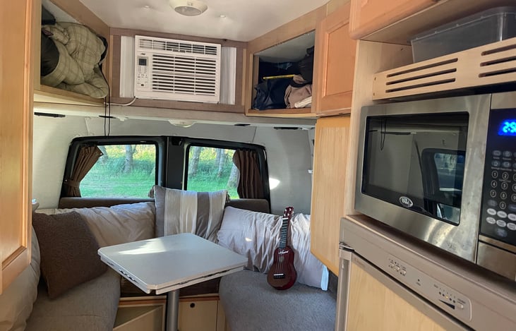 Large rear dining table offers plenty of space to enjoy the wrap around view.  Open the back doors for a cool breeze - the full wrap around zippered bug netting will keep the mosquito's at bay.