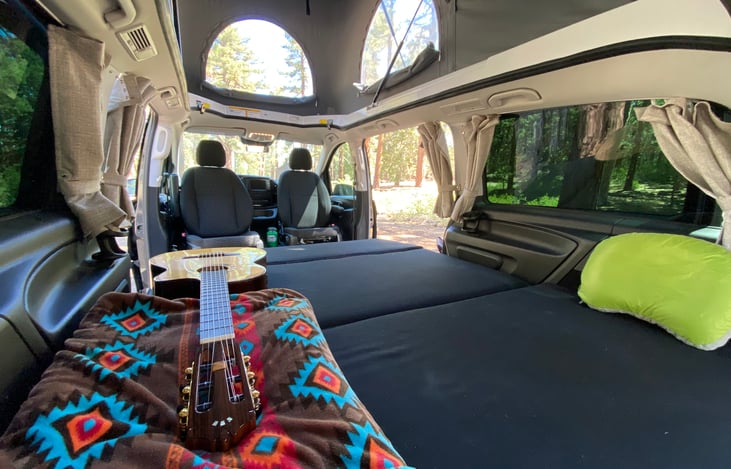 Rear bench in open bed position. Room for 2