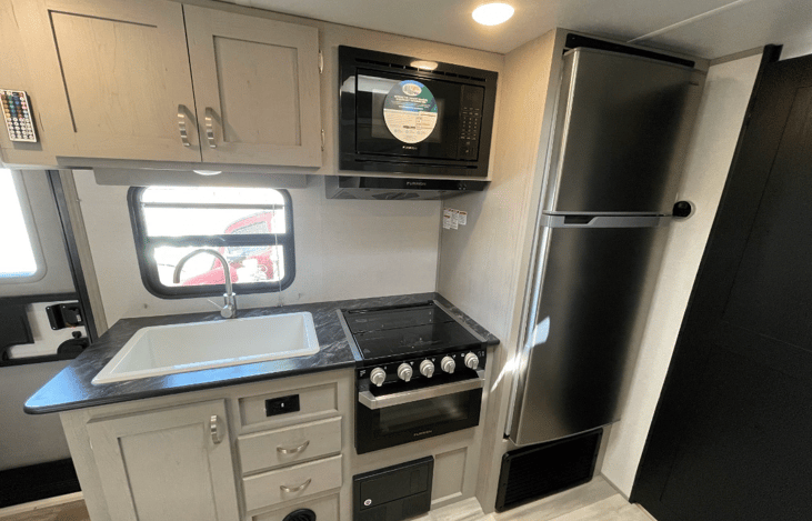 Large Sink With Soap Dispenser & 3 Burner stove with glass lead