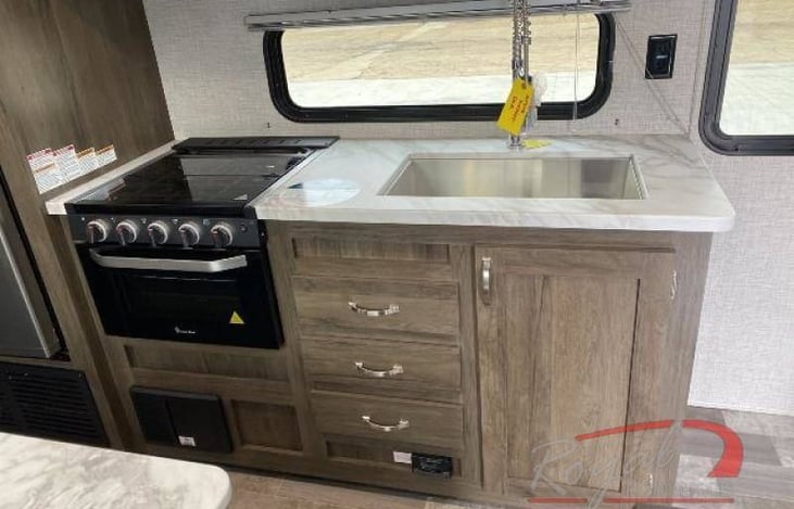 Extra-large sink three top burners and a  good size refrigerator