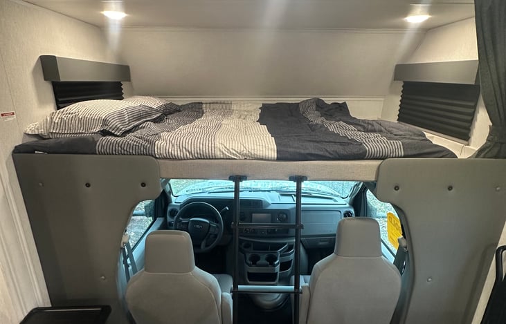 Bunk above captains seats with memory foam topper, sleeps 2.