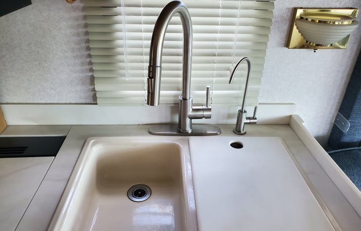 Updated kitchen faucet,  with purified drinking water dispenser.