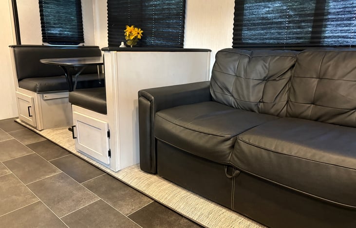 Dinette and couch that convert to beds.