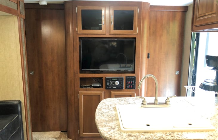 Entertainment Center - TV, DVD player, AM/FM radio, Bluetooth ready