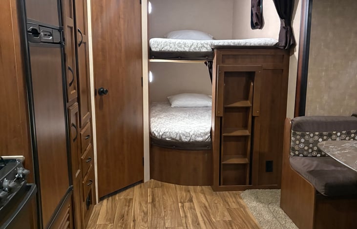 Two full size bunks with option to pull out curtain for privacy.