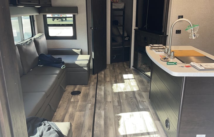 Couch pulls out and turns into a bed. Also have two tables that can be placed there.