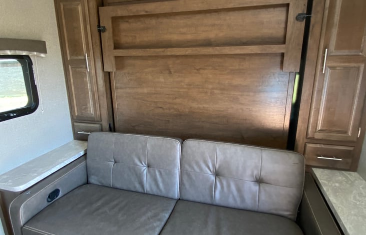 Couch folds down and the murphy bed folds down on top of couch for a queen size bed with memory foam topper on top of mattress.